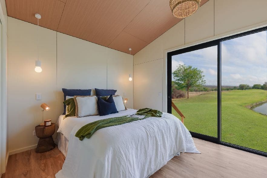 Bedroom lined with Hydrawall decor panels and woodgrain ceiling